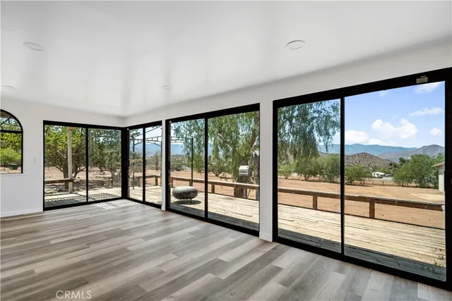 a view of a room with large windows