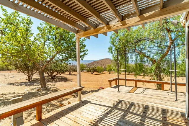 a view of a balcony with wooden floor