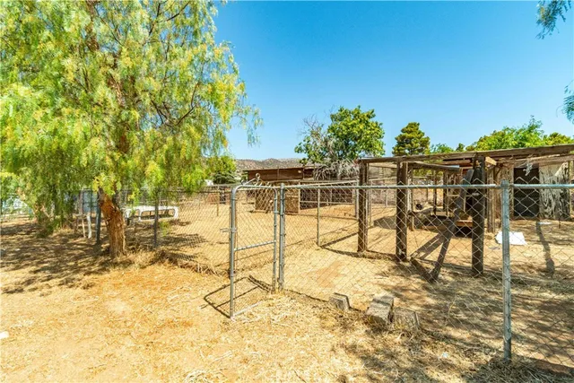 a view of a chairs and table on the patio