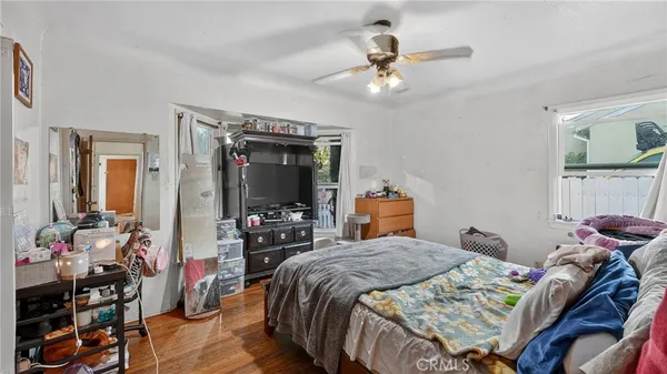 a bed room with a bed and a tv