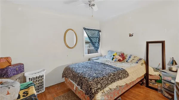 a bedroom with bed and a window