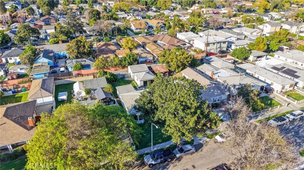 an aerial view of residential houses with outdoor space