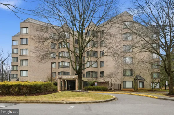 a view of a building with a yard