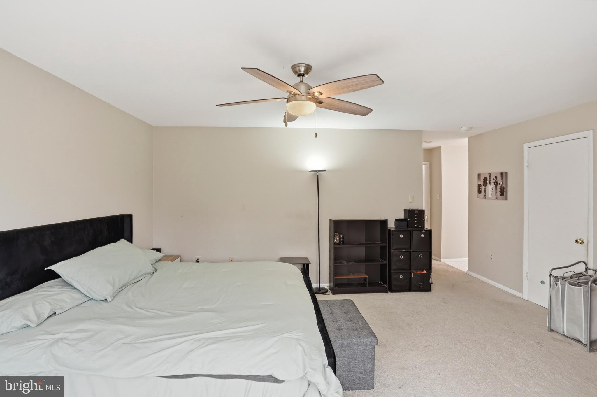 3021 Fallstaff Road, Unit 502B Baltimore, MD 21209 - Photo 16 of 39 a bedroom with a bed and a ceiling fan
