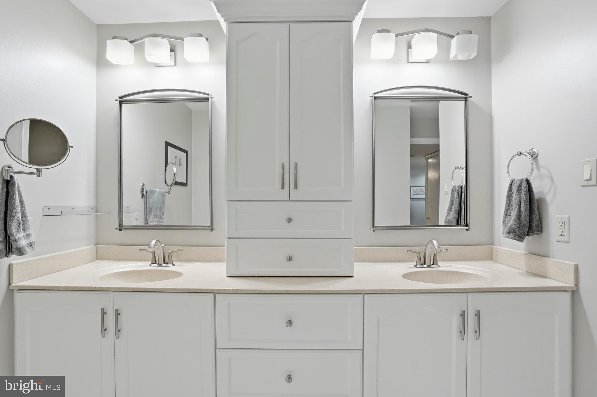 3021 Fallstaff Road, Unit 502B Baltimore, MD 21209 - Photo 18 of 39 a bathroom with a sink vanity and mirror