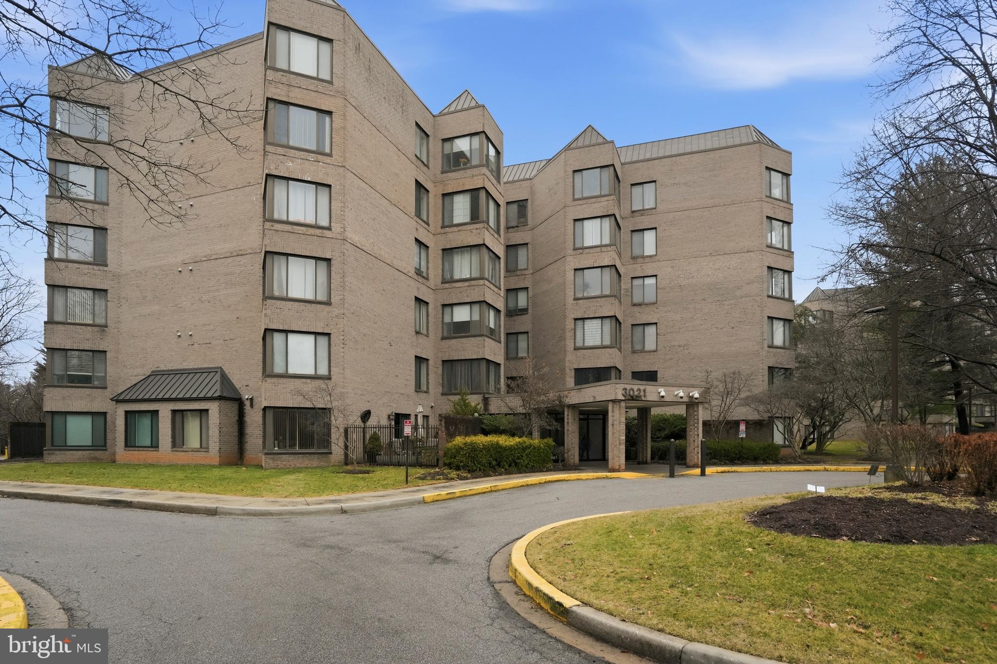 3021 Fallstaff Road, Unit 502B Baltimore, MD 21209 - Photo 2 of 39 a view of a large pool with lawn chairs and a lawn chairs
