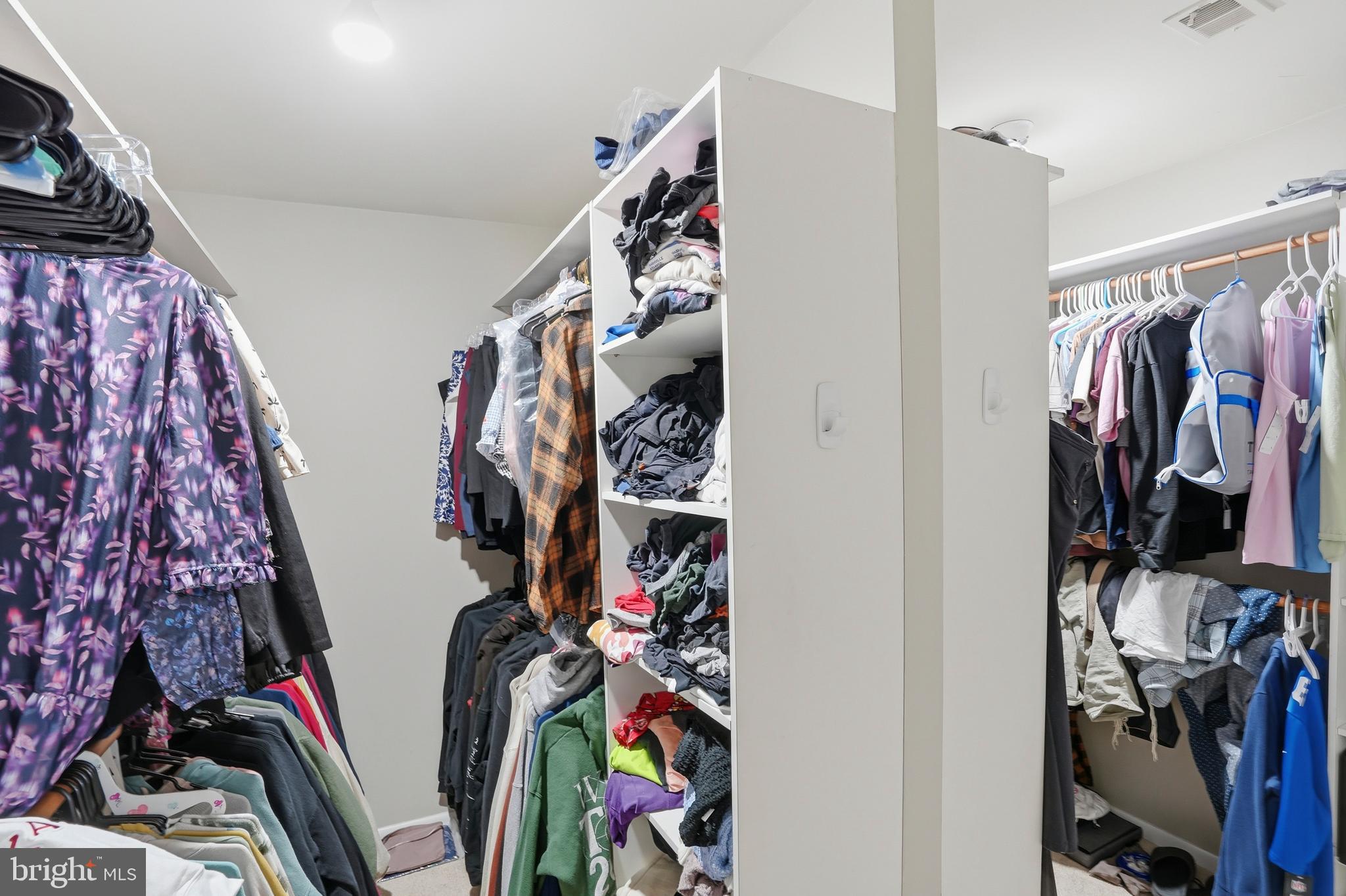 3021 Fallstaff Road, Unit 502B Baltimore, MD 21209 - Photo 22 of 39 a view of walk in closet with clothes