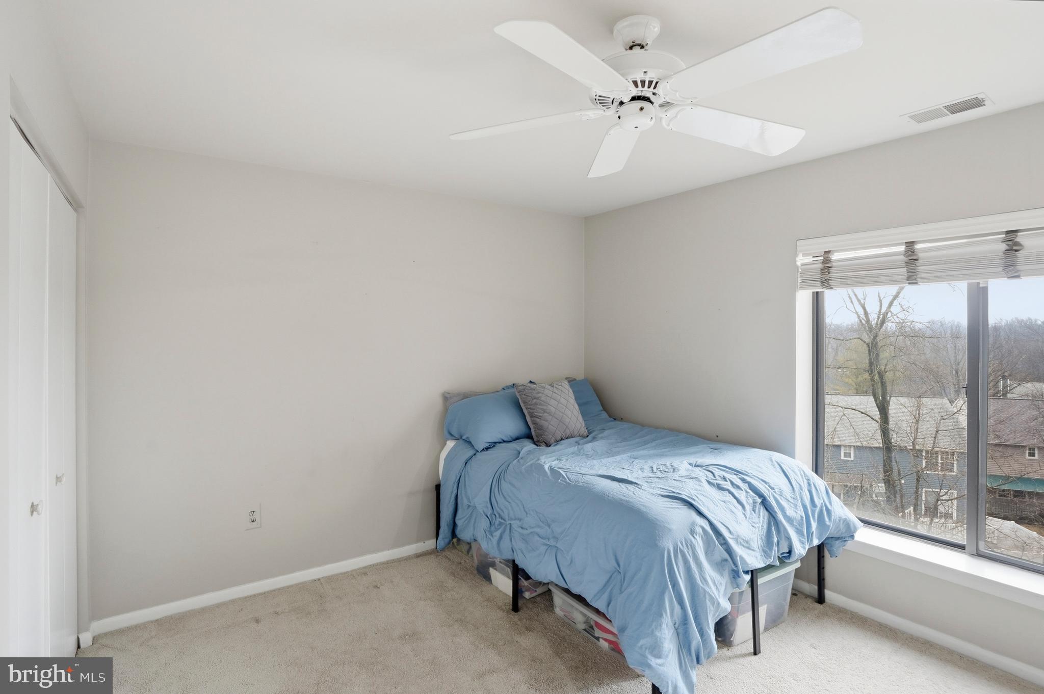 3021 Fallstaff Road, Unit 502B Baltimore, MD 21209 - Photo 24 of 39 a bedroom with a bed and window