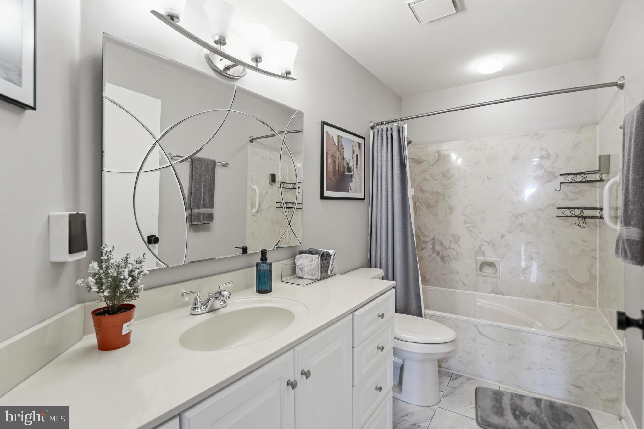 3021 Fallstaff Road, Unit 502B Baltimore, MD 21209 - Photo 27 of 39 a bathroom with a sink toilet and shower