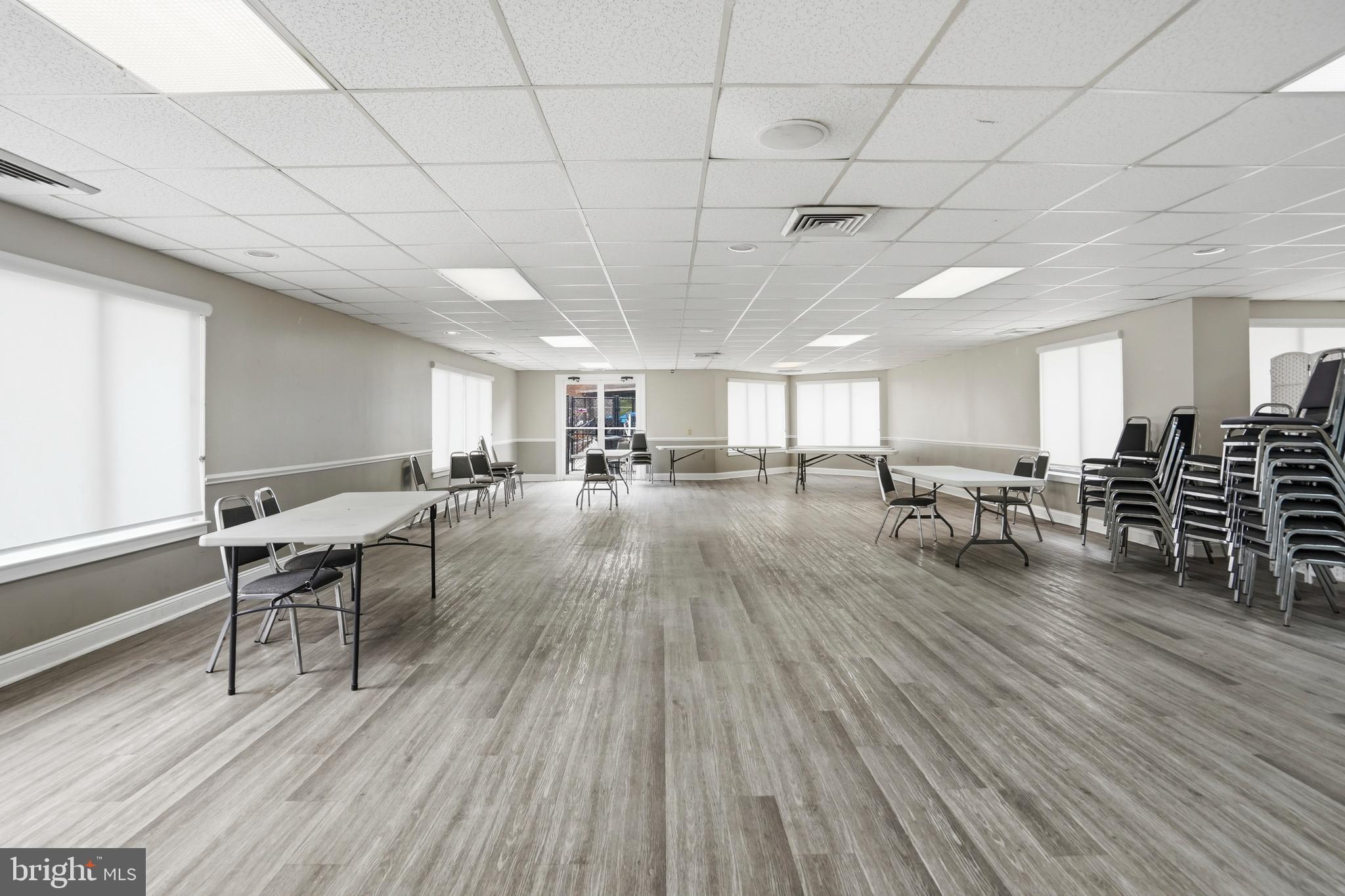 3021 Fallstaff Road, Unit 502B Baltimore, MD 21209 - Photo 32 of 39 a room with lots of furniture and wooden floors