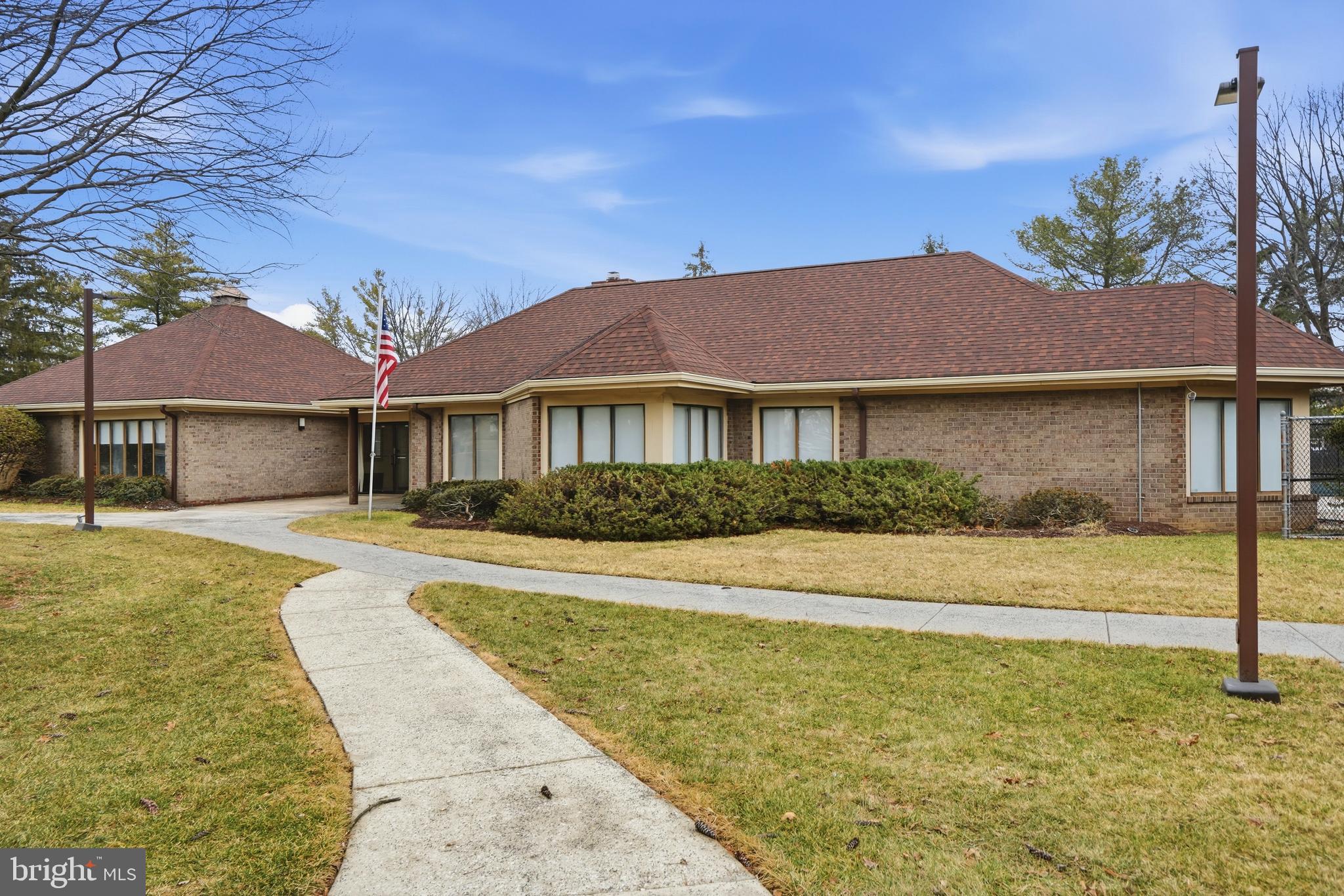 3021 Fallstaff Road, Unit 502B Baltimore, MD 21209 - Photo 36 of 39 a front view of a house with a yard