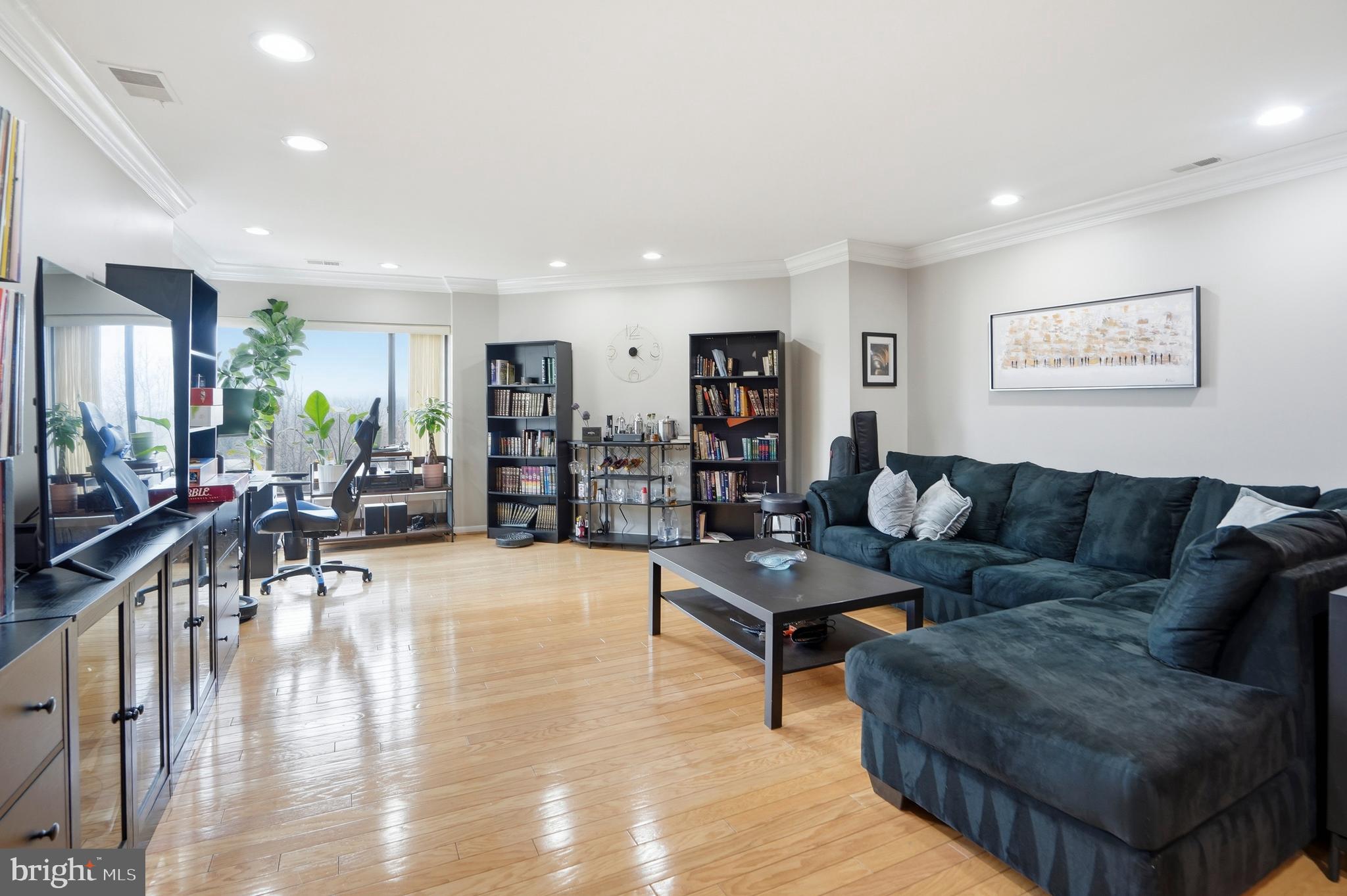 3021 Fallstaff Road, Unit 502B Baltimore, MD 21209 - Photo 4 of 39 a living room with furniture and wooden floor