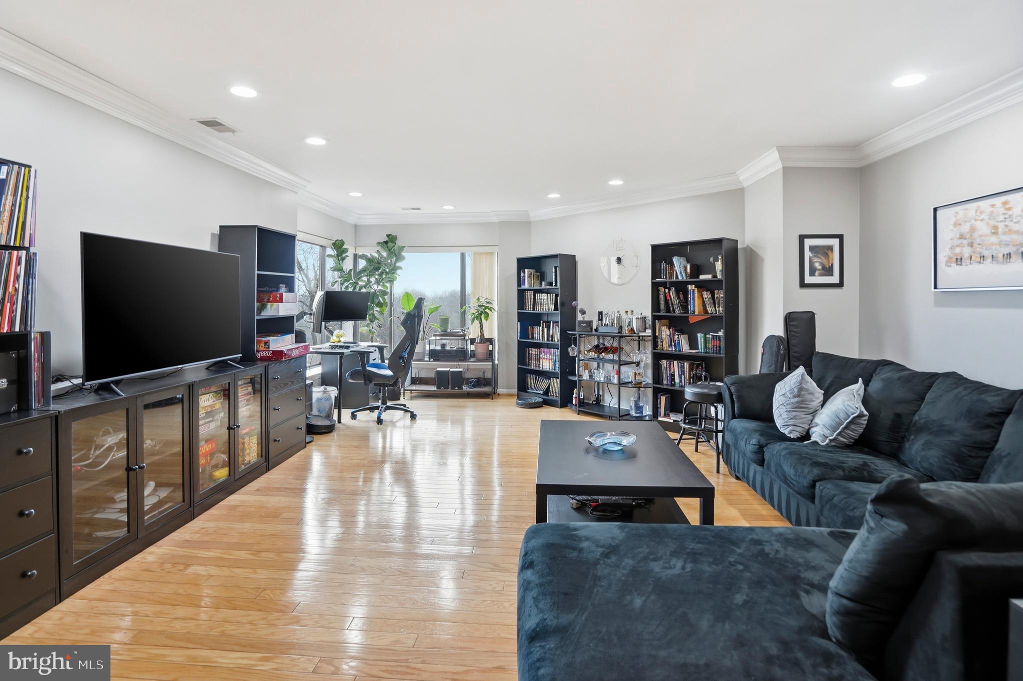 3021 Fallstaff Road, Unit 502B Baltimore, MD 21209 - Photo 5 of 39 a living room with furniture and a flat screen tv