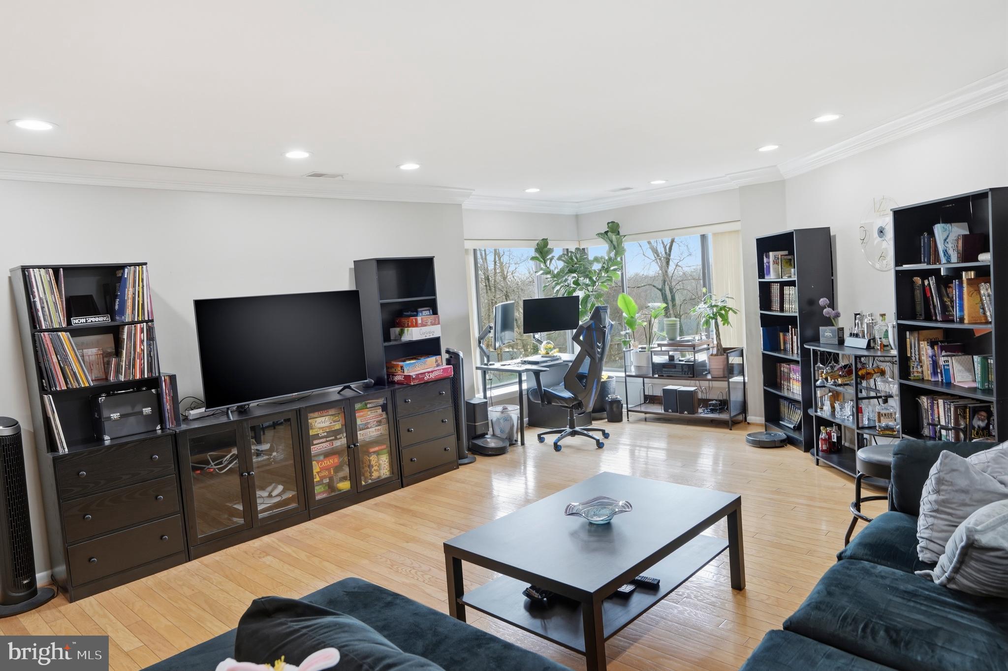 3021 Fallstaff Road, Unit 502B Baltimore, MD 21209 - Photo 39 of 39 a living room with furniture and a flat screen tv