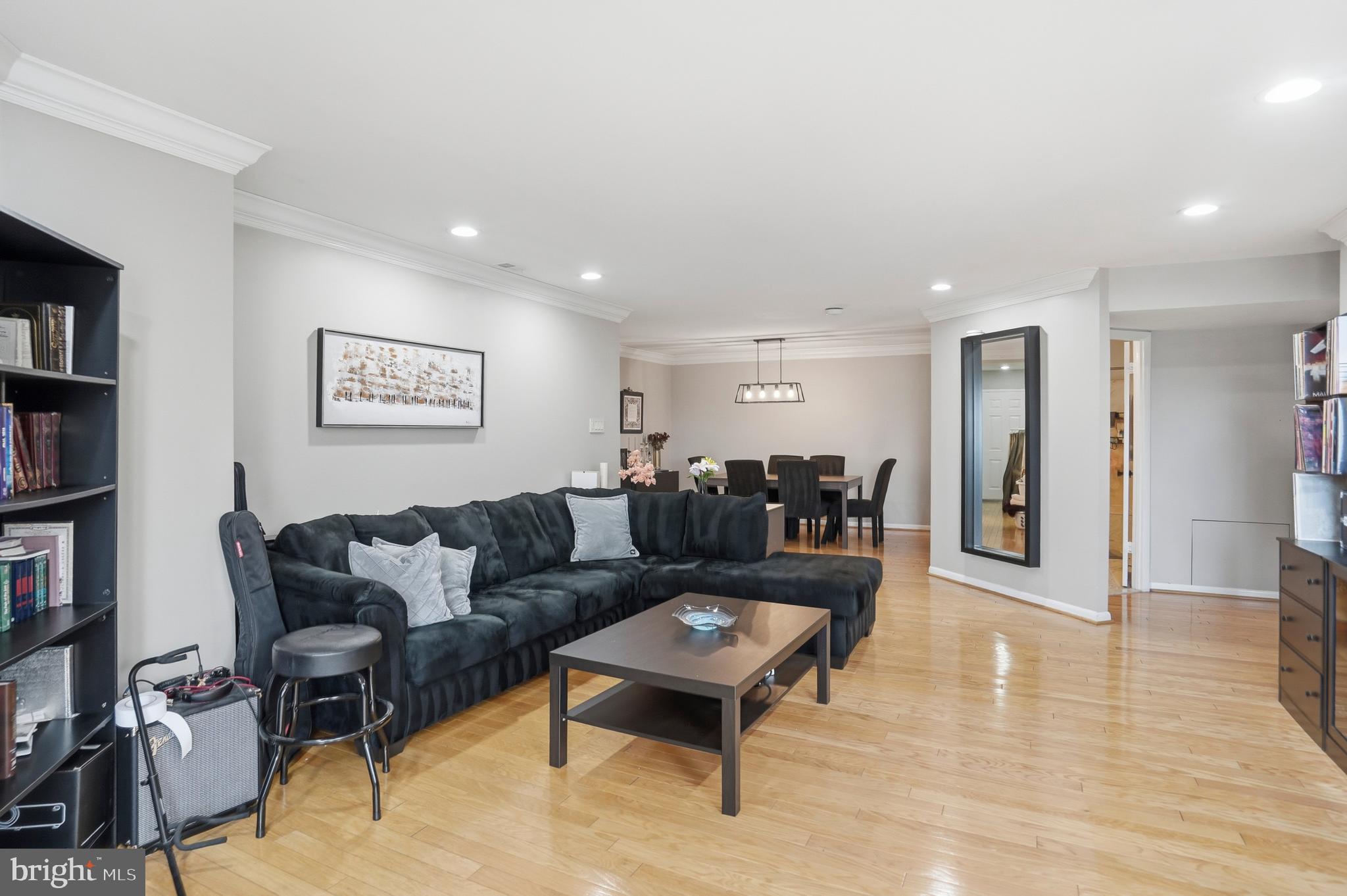 3021 Fallstaff Road, Unit 502B Baltimore, MD 21209 - Photo 7 of 39 a living room with furniture and a wooden floor
