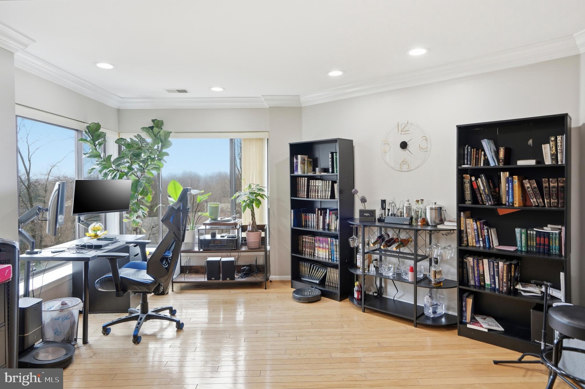 3021 Fallstaff Road, Unit 502B Baltimore, MD 21209 - Photo 8 of 39 a view of a livingroom with workspace and a bookshelf