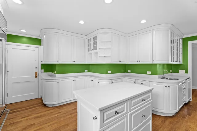 a white stove top oven sitting inside of a kitchen