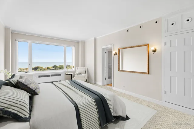 a bathroom with a granite countertop sink toilet and mirror