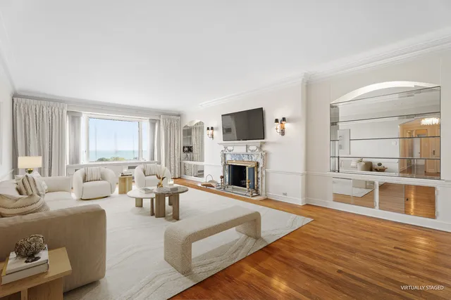 a living room with a fireplace and a table