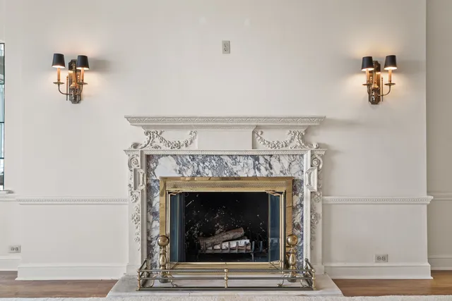 a view of a dining room with furniture wooden floor and chandelier