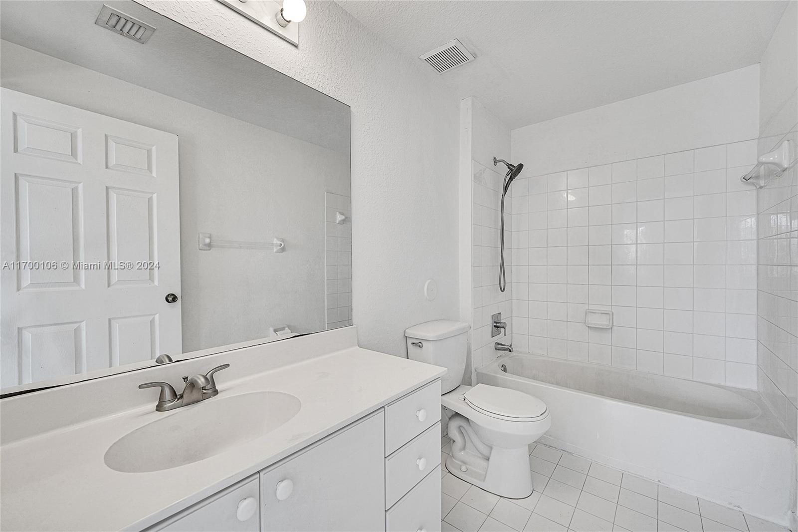 6940 Northwest 179th Street, Unit 3057 Hialeah, FL 33015 - Photo 11 of 32 a bathroom with a sink toilet and shower