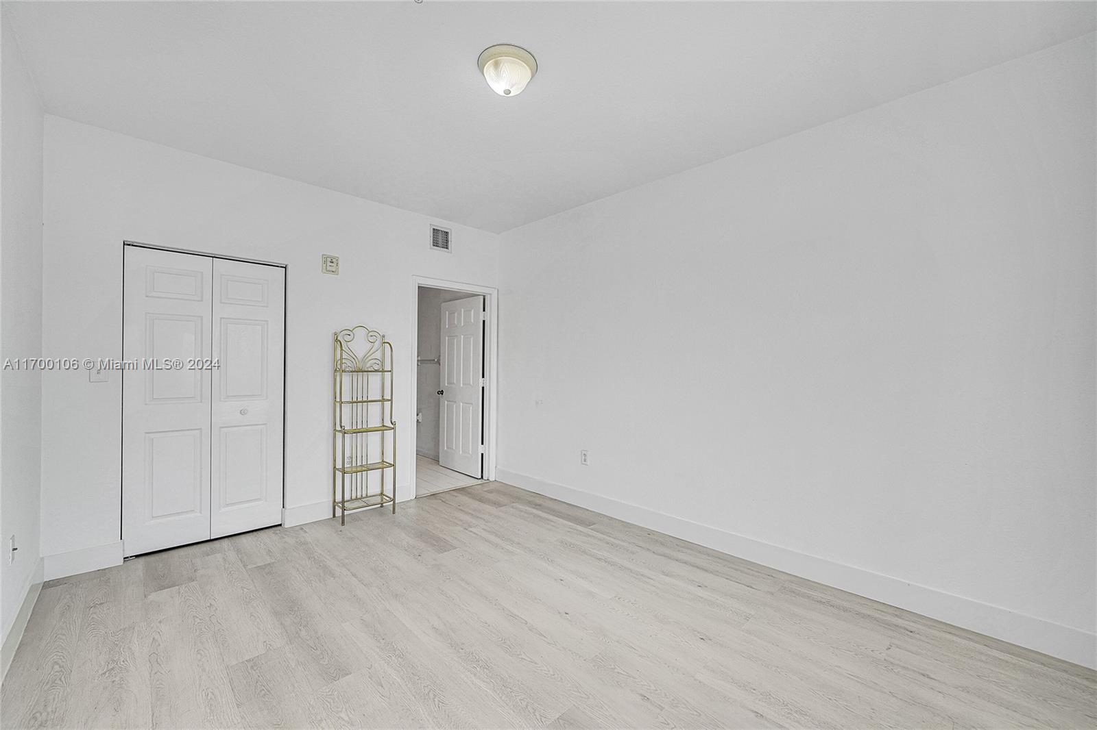 6940 Northwest 179th Street, Unit 3057 Hialeah, FL 33015 - Photo 15 of 32 an empty room with closet area