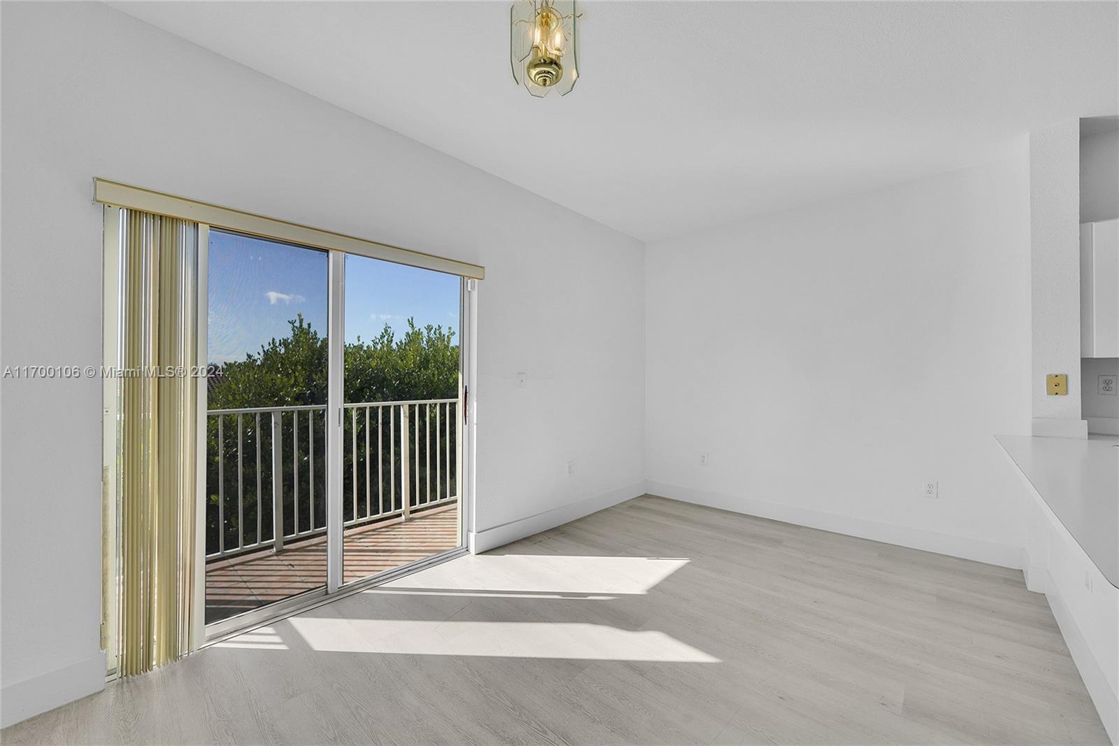 6940 Northwest 179th Street, Unit 3057 Hialeah, FL 33015 - Photo 17 of 32 a view of an empty room with a window