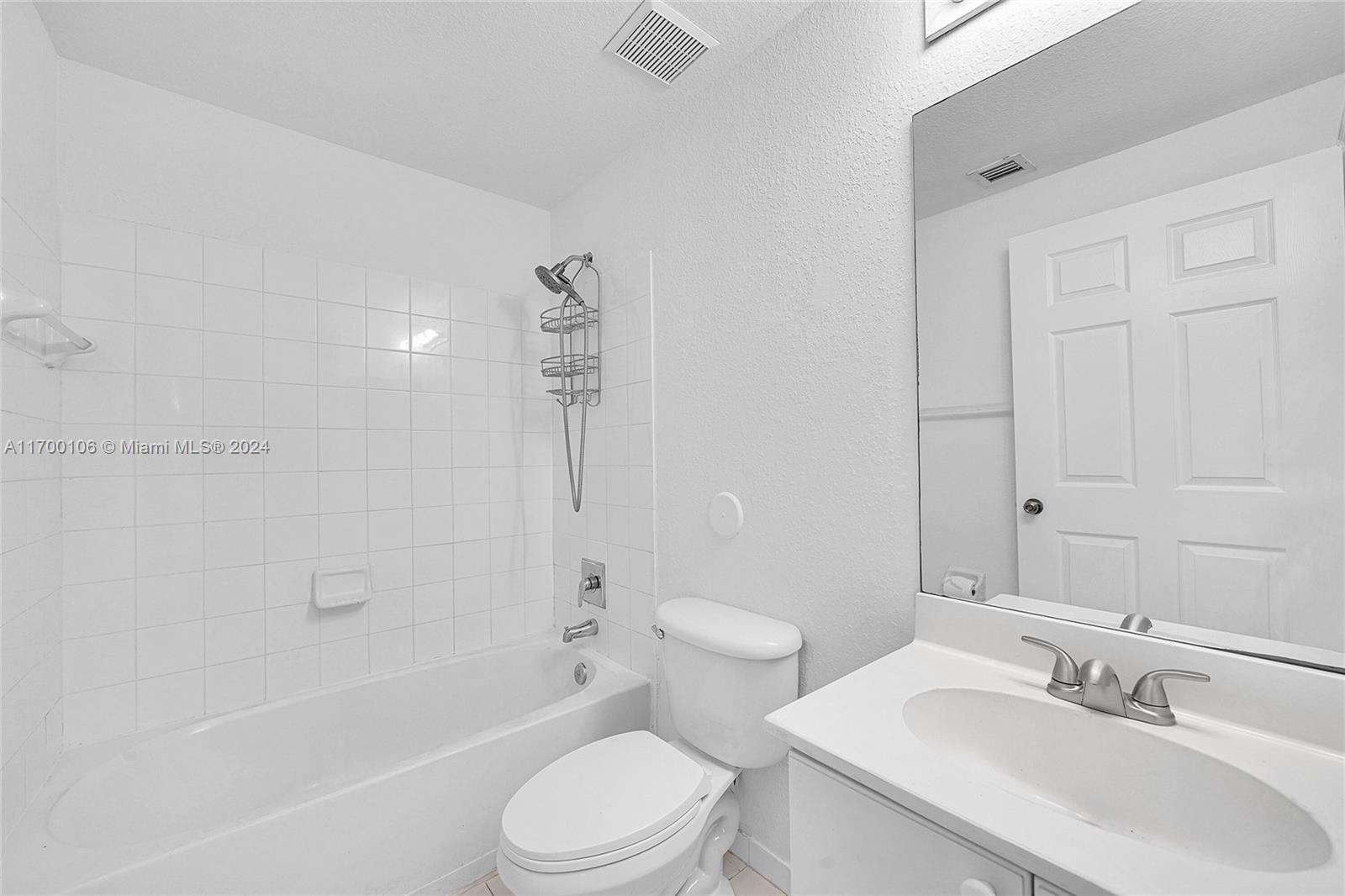 6940 Northwest 179th Street, Unit 3057 Hialeah, FL 33015 - Photo 21 of 32 a bathroom with a sink toilet and shower