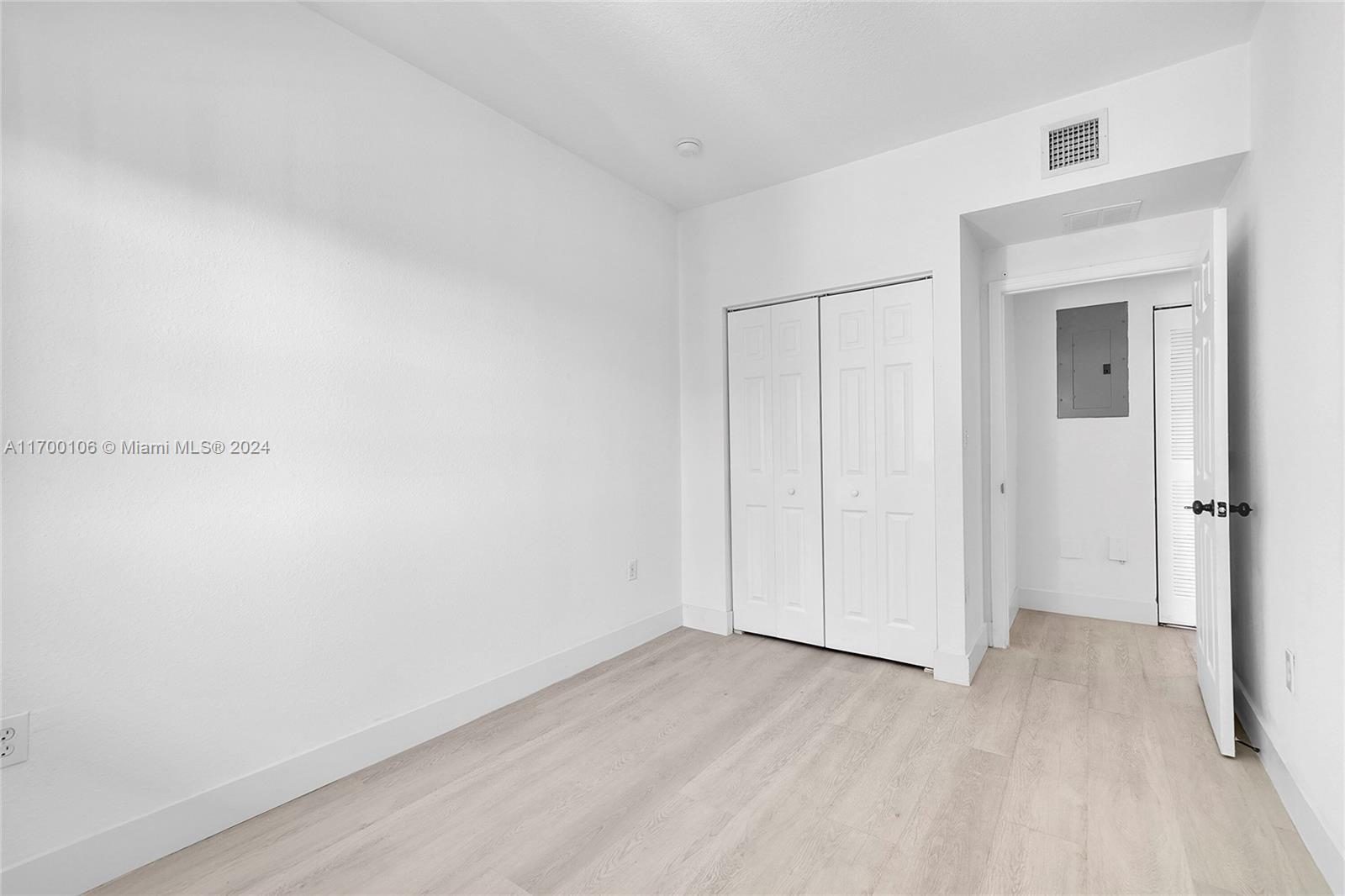 6940 Northwest 179th Street, Unit 3057 Hialeah, FL 33015 - Photo 22 of 32 a view of an empty room