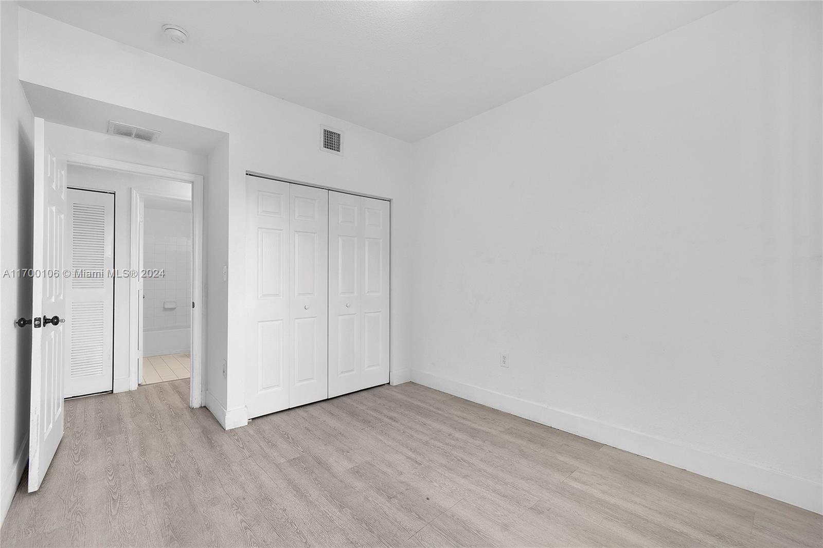 6940 Northwest 179th Street, Unit 3057 Hialeah, FL 33015 - Photo 24 of 32 a view of an empty room