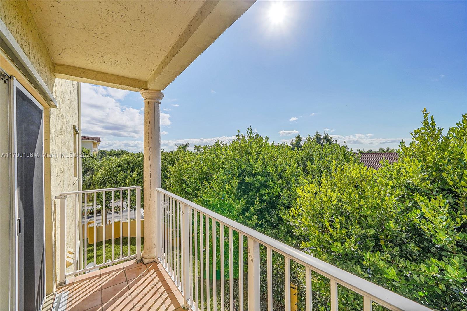 6940 Northwest 179th Street, Unit 3057 Hialeah, FL 33015 - Photo 30 of 32 a view of a balcony with an outdoor space