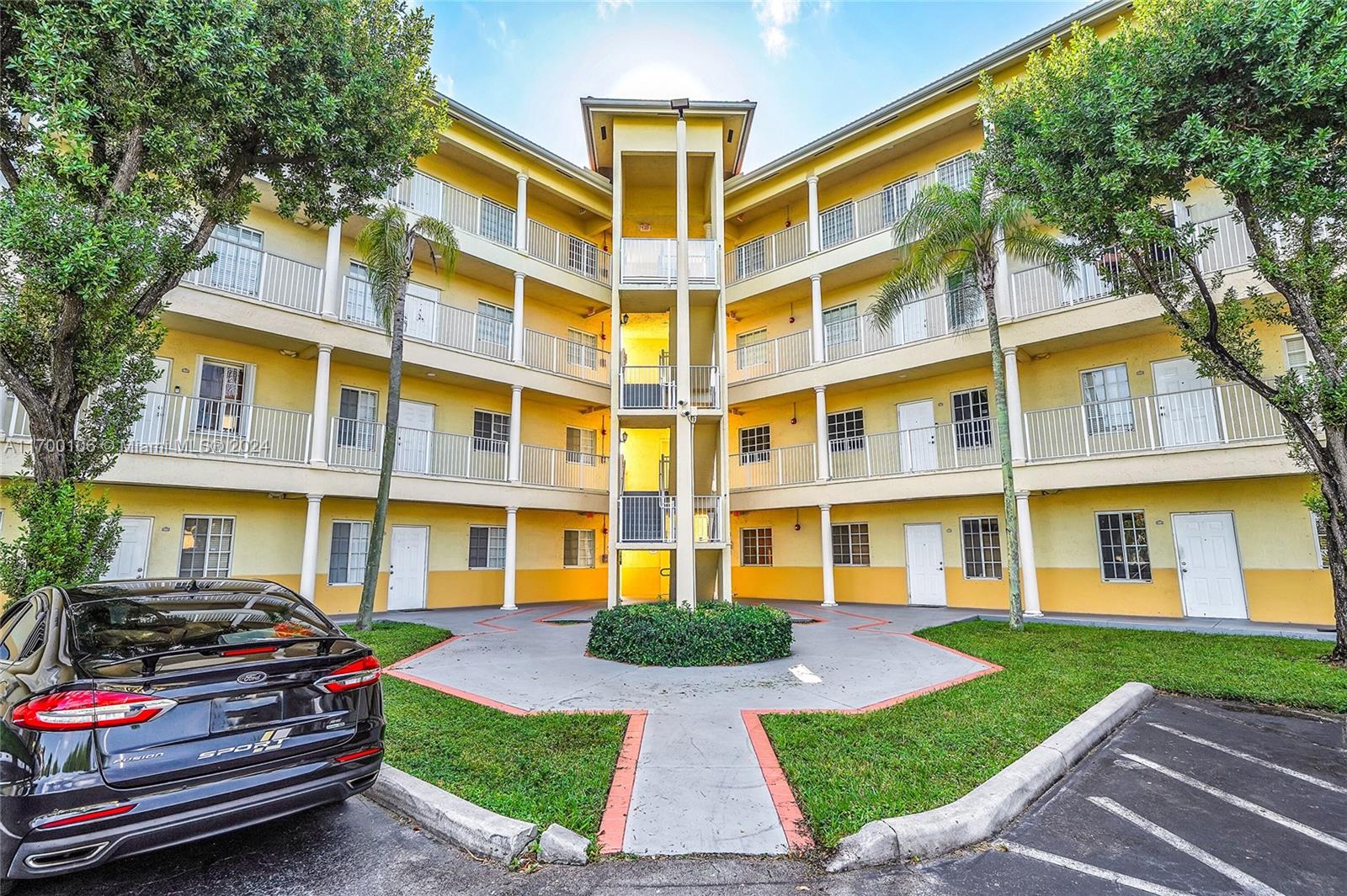6940 Northwest 179th Street, Unit 3057 Hialeah, FL 33015 - Photo 3 of 32 a front view of a building