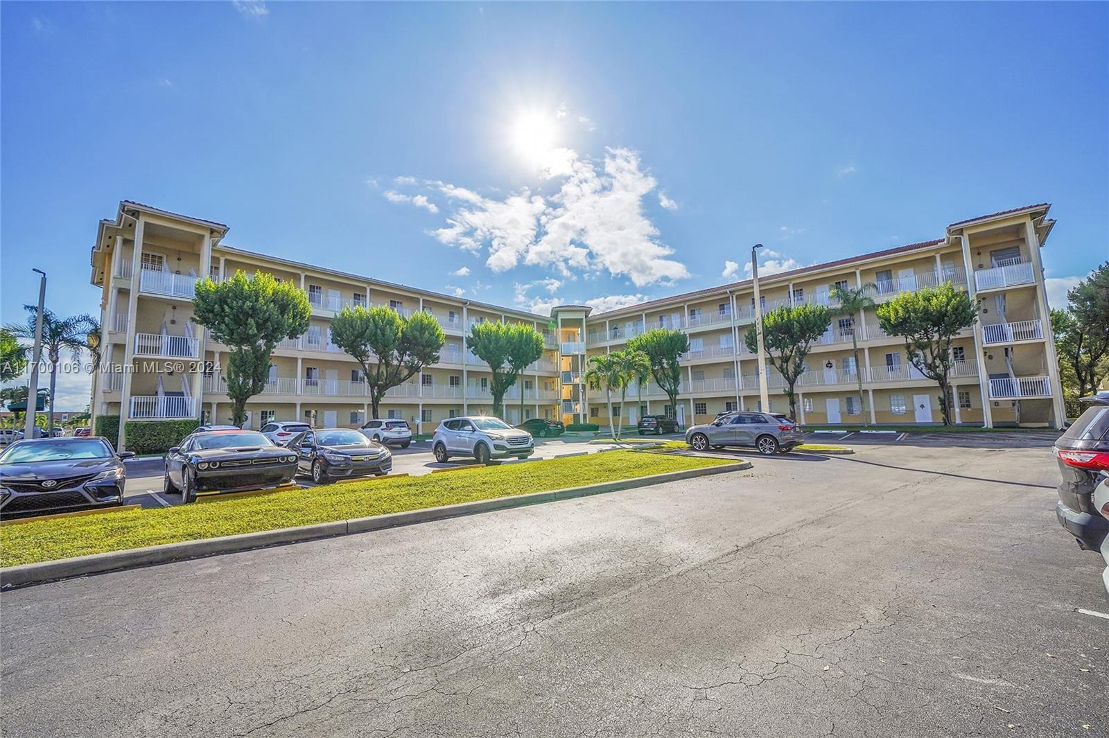 6940 Northwest 179th Street, Unit 3057 Hialeah, FL 33015 - Photo 4 of 32 a view of a house with swimming pool and sitting area