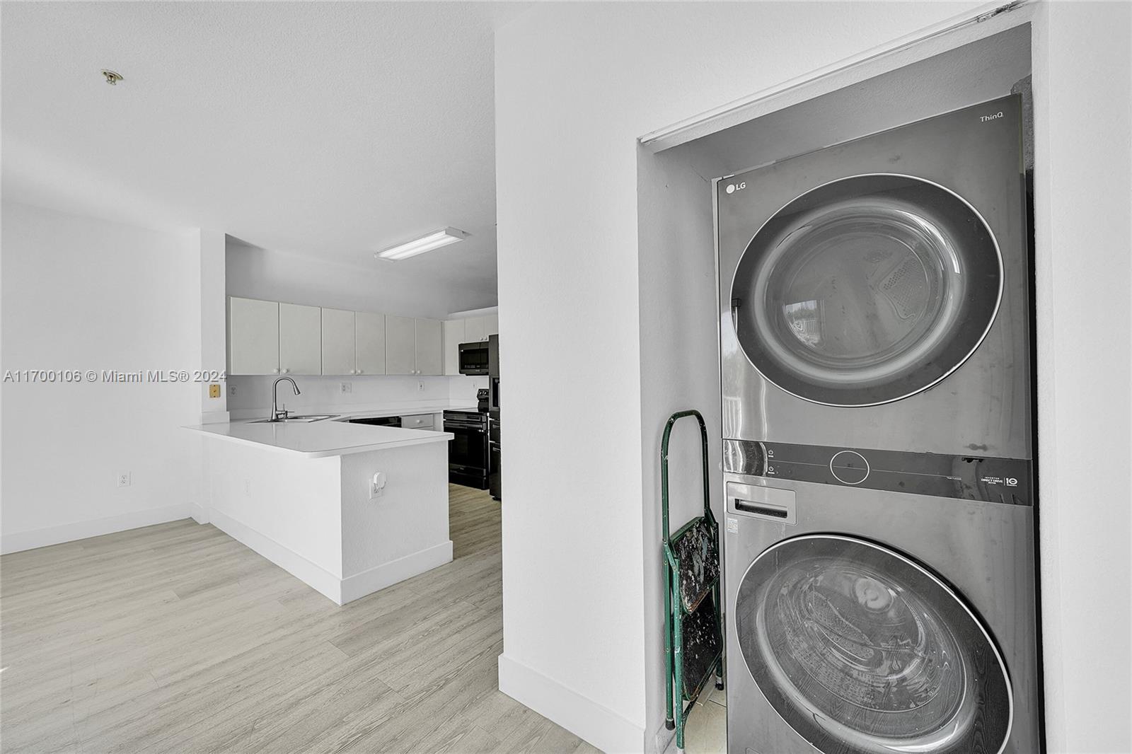 6940 Northwest 179th Street, Unit 3057 Hialeah, FL 33015 - Photo 7 of 32 a view of a kitchen with a washer and dryer