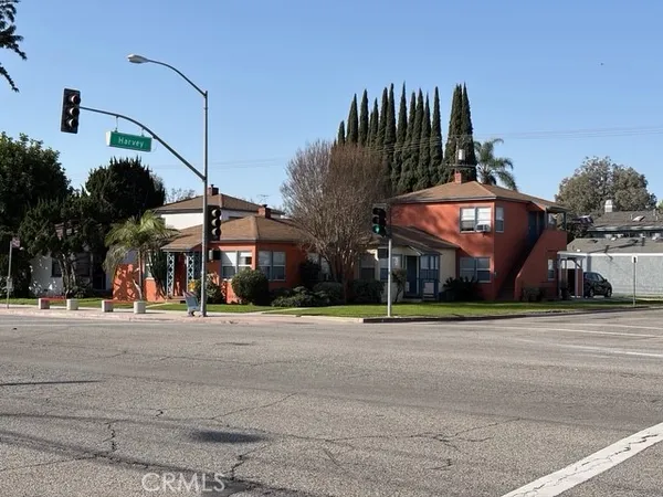a group of cars parked on the side of street