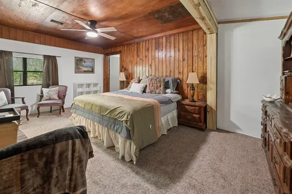 a bed room with a bed and a couch