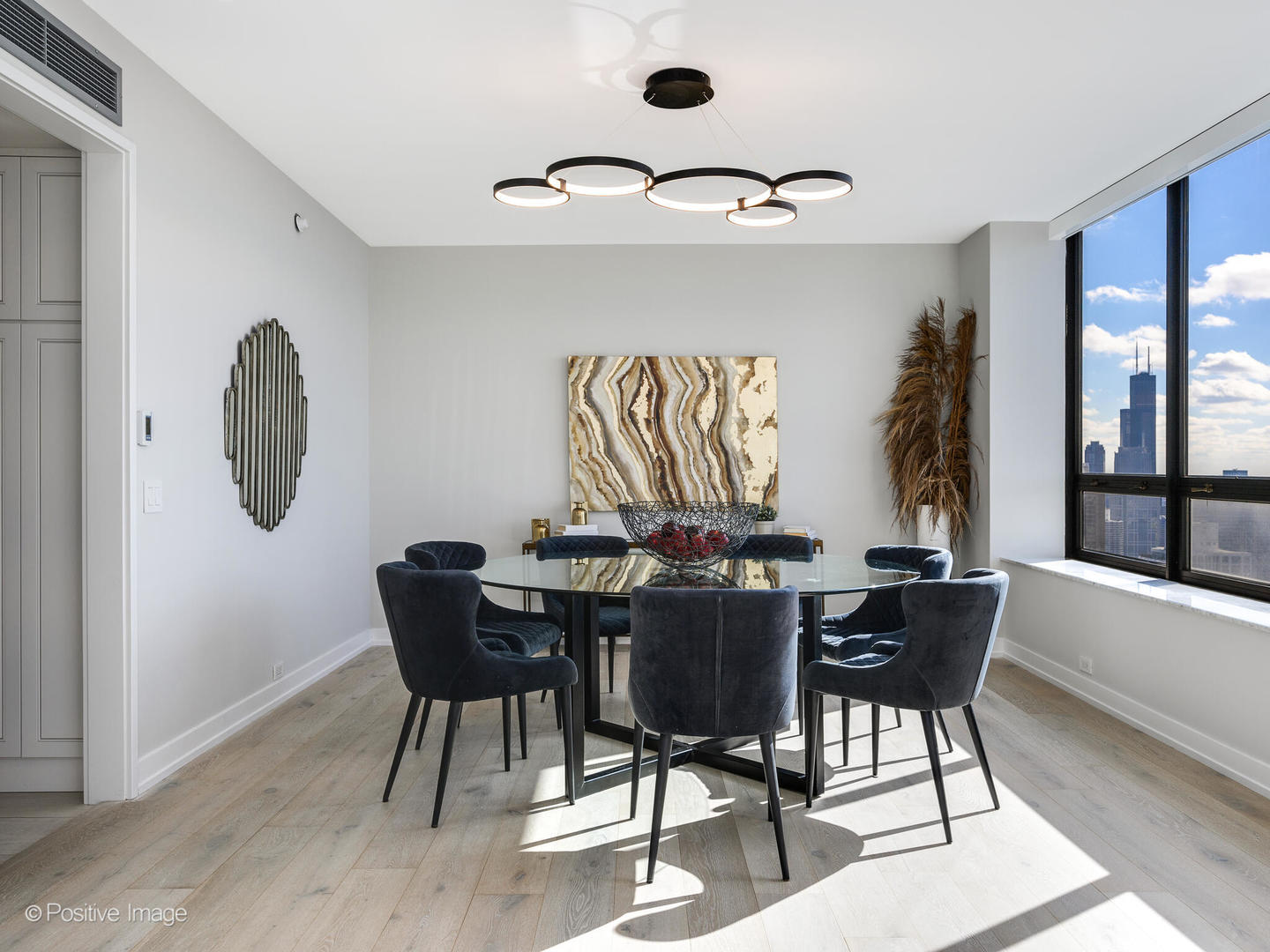 180 East Pearson Street, Unit 6501 Chicago, IL 60611 - Photo 11 of 35 a view of a dining room with furniture window and wooden floor