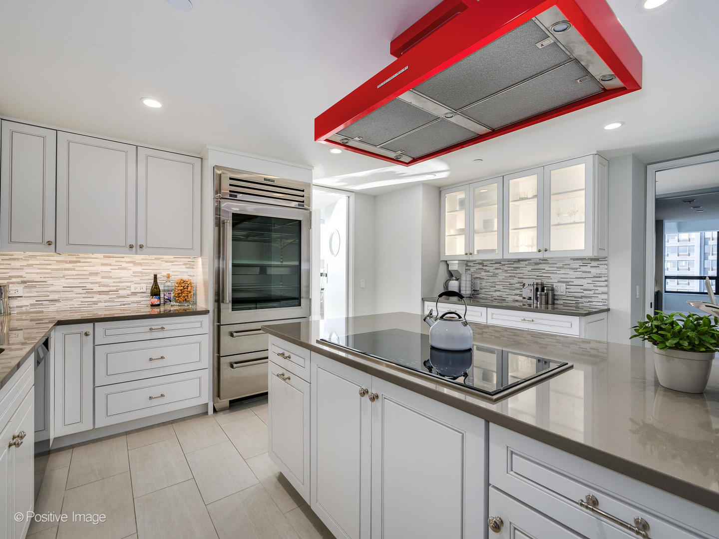 180 East Pearson Street, Unit 6501 Chicago, IL 60611 - Photo 13 of 35 a kitchen with cabinets appliances a sink and a counter top space