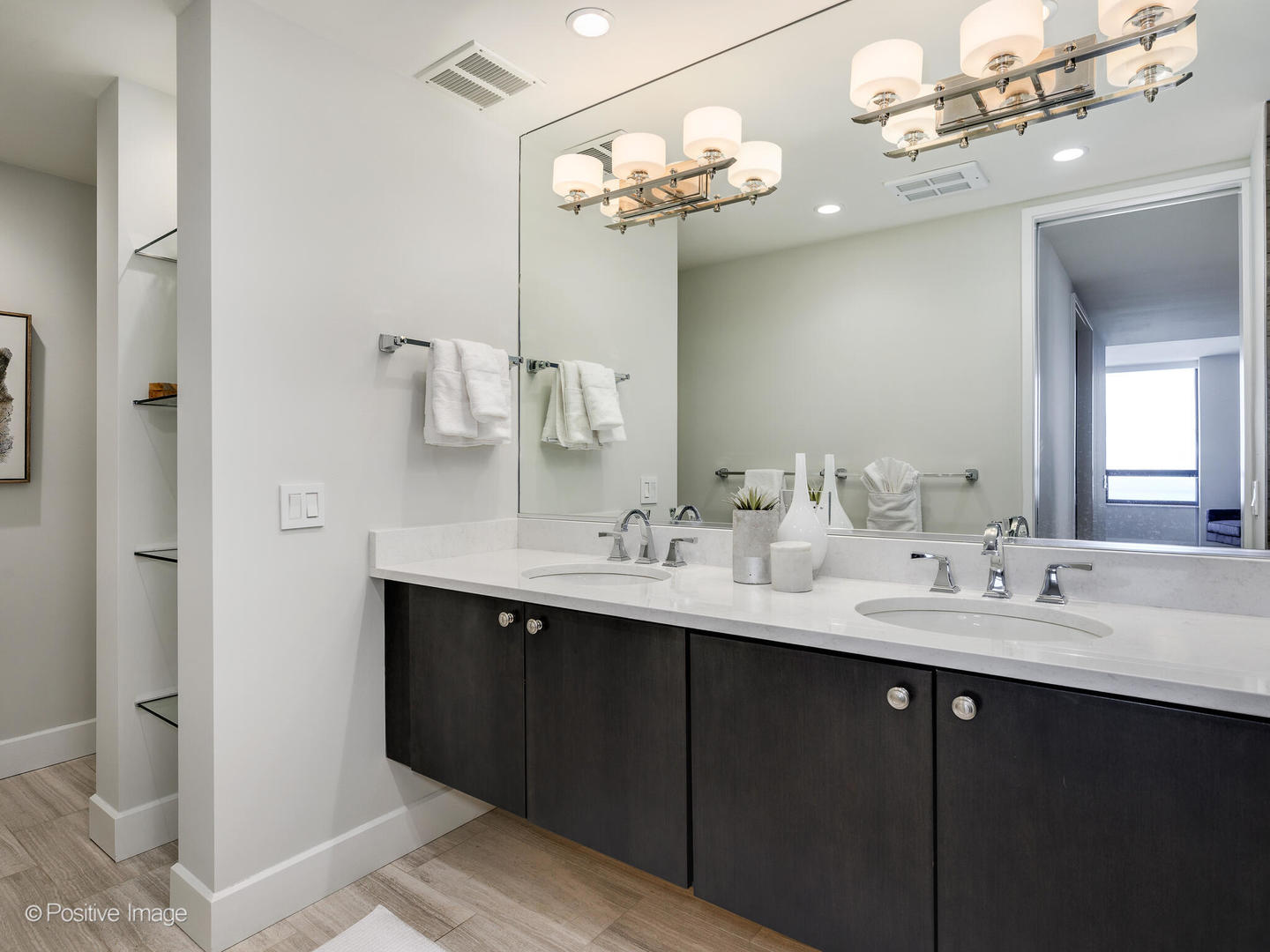 180 East Pearson Street, Unit 6501 Chicago, IL 60611 - Photo 24 of 35 a bathroom with a double vanity sink and a mirror