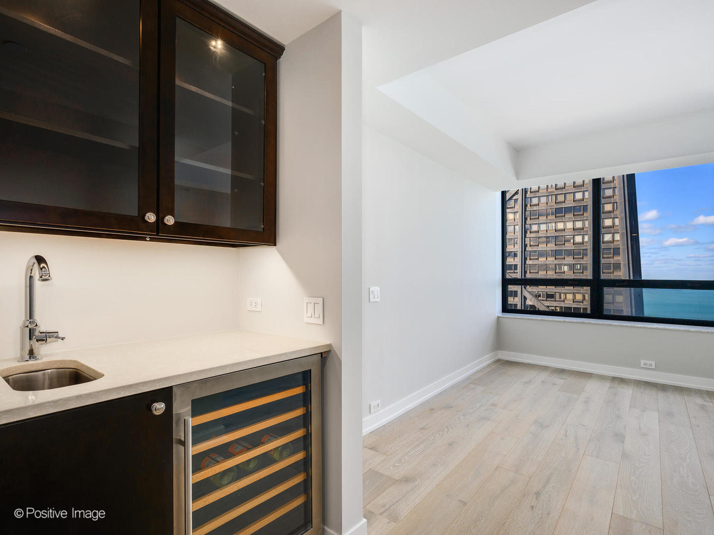 180 East Pearson Street, Unit 6501 Chicago, IL 60611 - Photo 25 of 35 a kitchen with a sink and a window