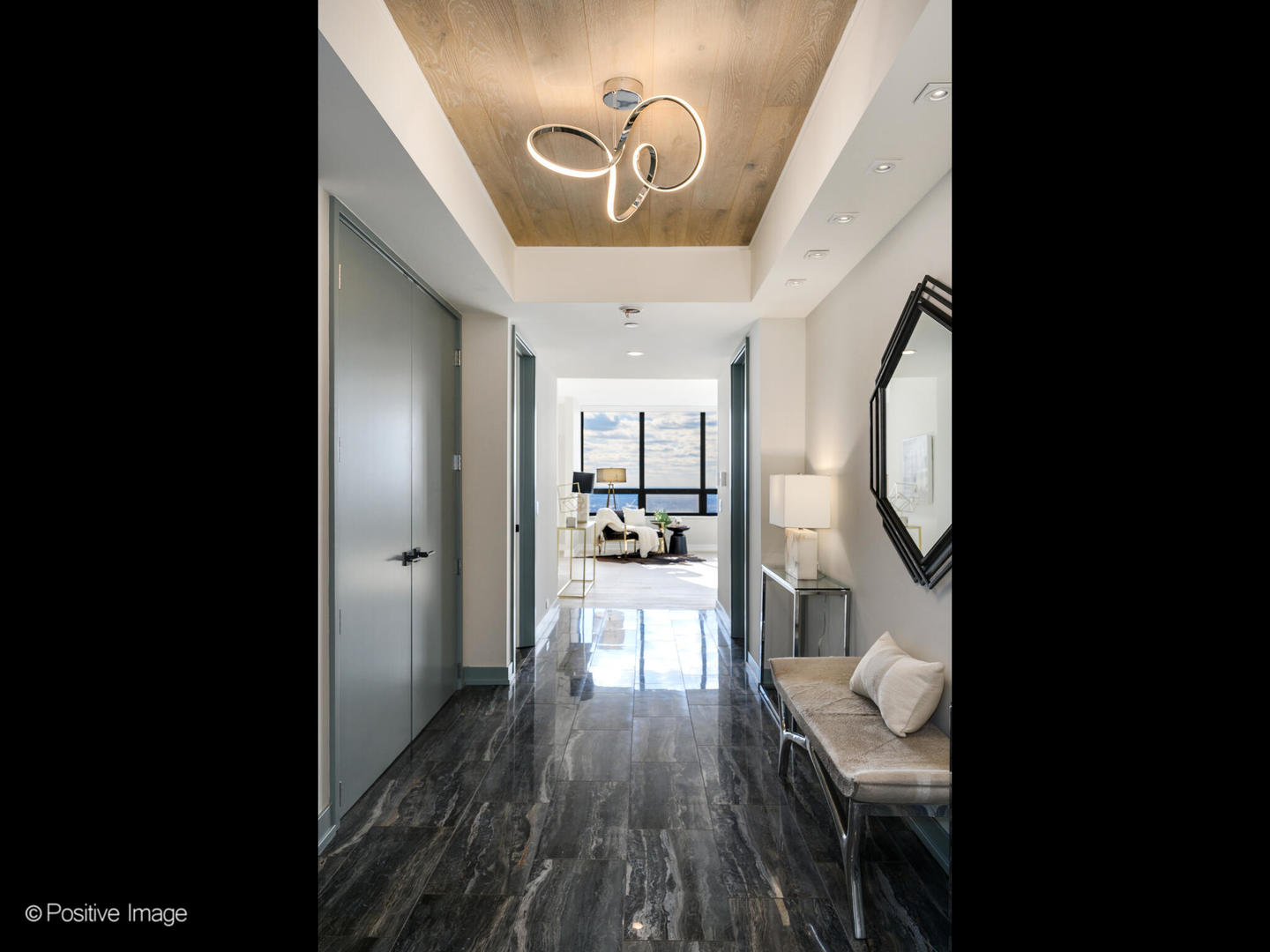 180 East Pearson Street, Unit 6501 Chicago, IL 60611 - Photo 6 of 35 a view of a hallway view with wooden floor and seating space
