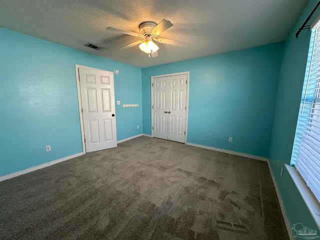 a bathroom with a double vanity sink toilet and shower