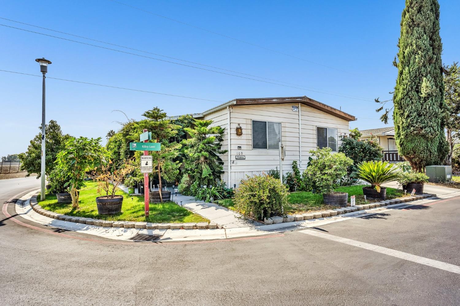 3950 Mack Road, Unit 169 Sacramento, CA 95823 - Photo 10 of 10 a front view of a house with a yard