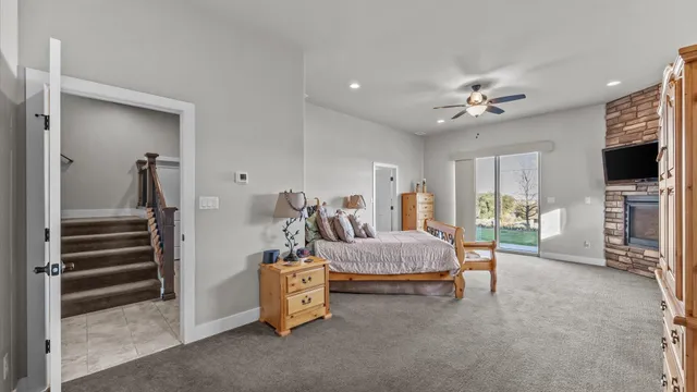 a bedroom with furniture and a flat screen tv