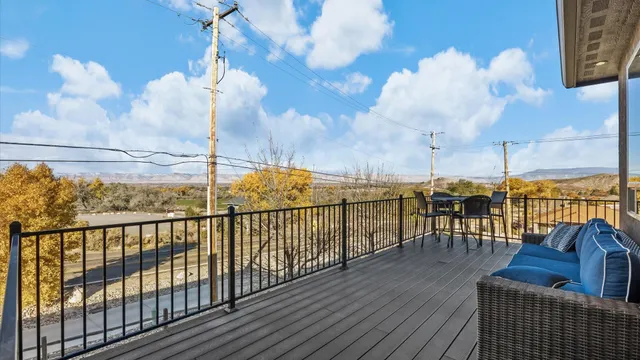 a view of a balcony with wooden floor