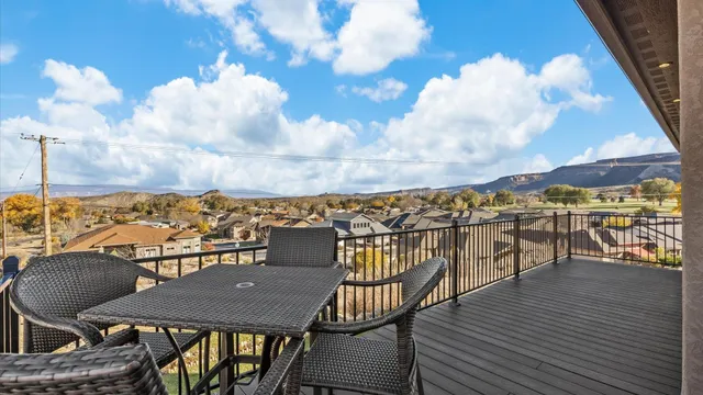 a view of a balcony with chairs