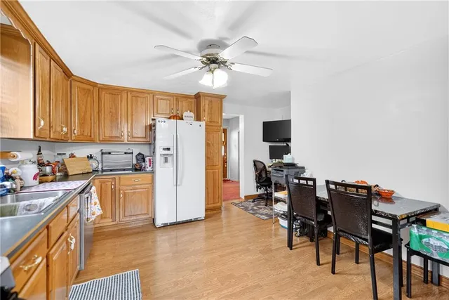 a view of a livingroom with workspace and a window