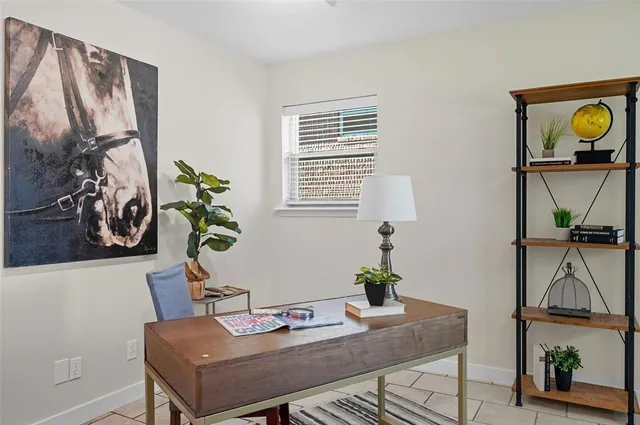 a view of a livingroom with furniture and workspace