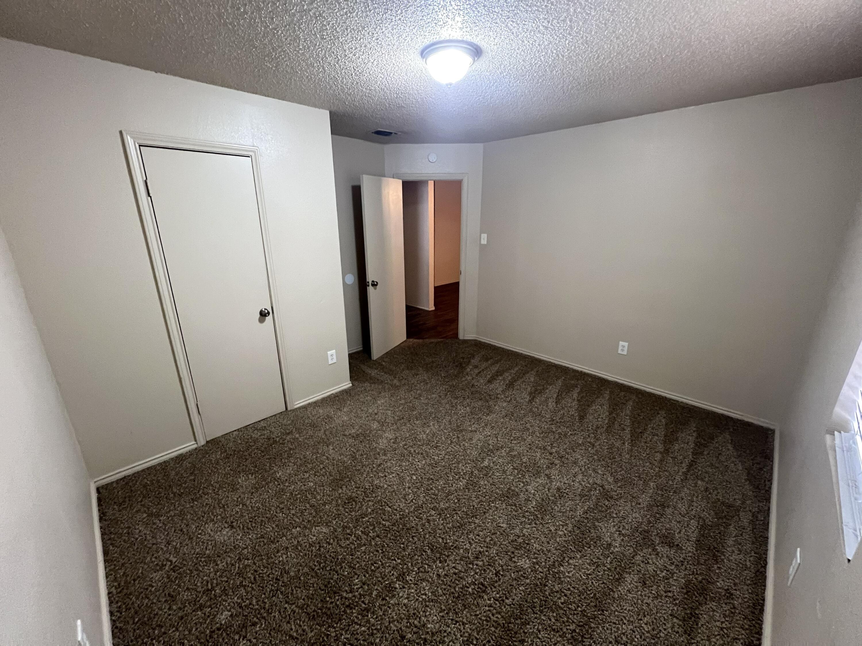 2403 88th Street Lubbock, TX 79423 - Photo 5 of 9 a view of an empty room
