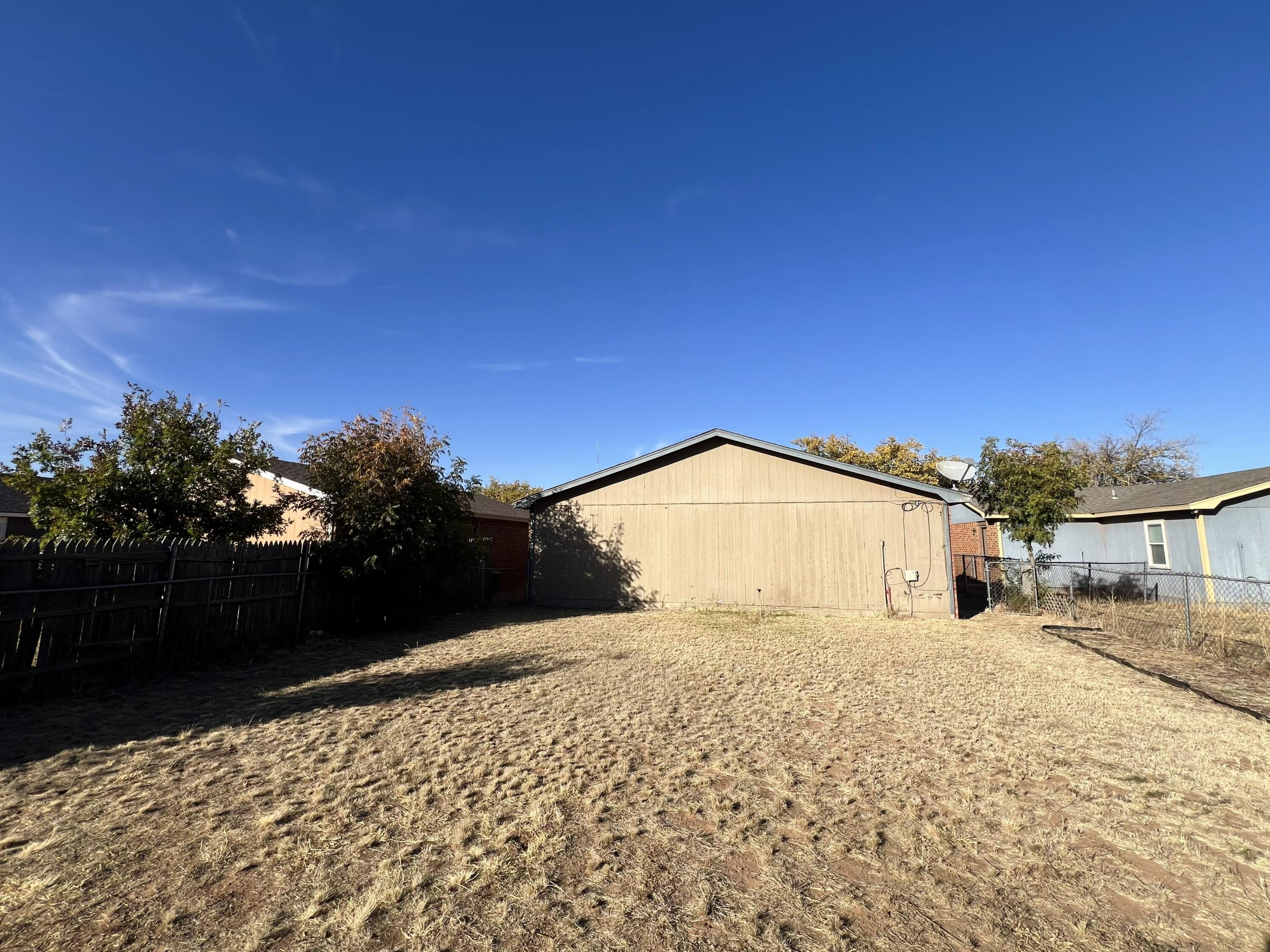 2403 88th Street Lubbock, TX 79423 - Photo 8 of 9 a view of a house with a snow in the background